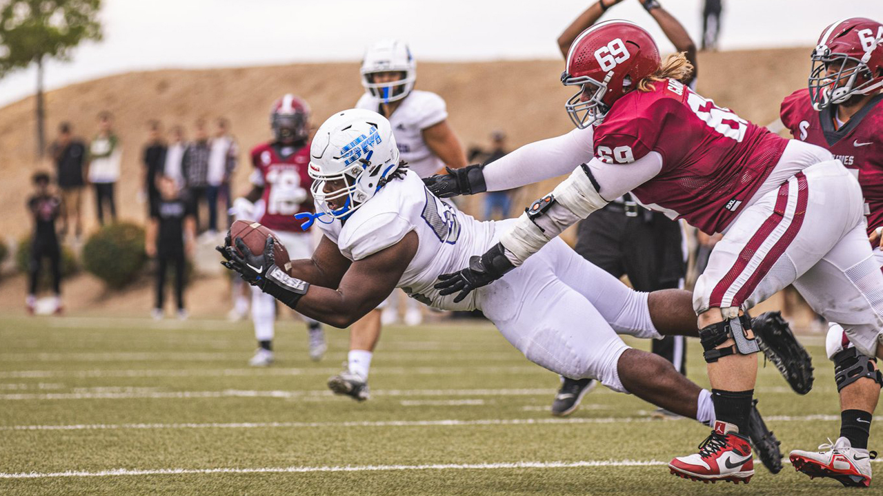 Max Dickson dives for his late-game interception that secured the CSM win. (Photo by Patrick Nguyen / @patrophoto)