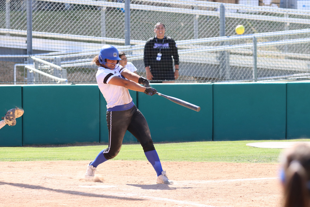 Bubbah Fa'aita blasts her game-winner home run over the right-center fence. (Photo by Richard Quinton/CCCAA)