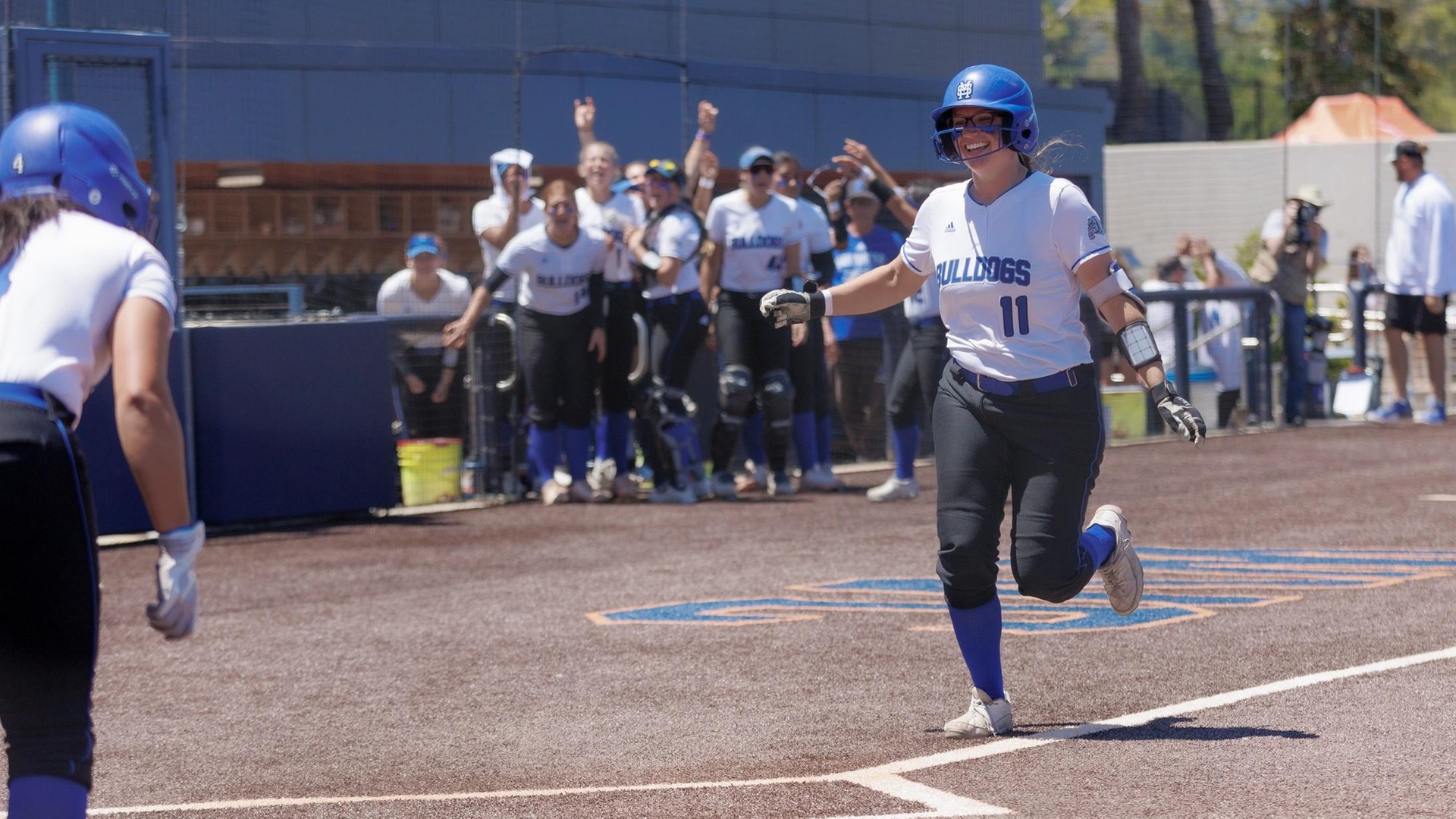 Megan Barstad is greeted at home plater after smashing a two-run home run in the fourth inning vs. Palomar. (Photo courtesy 3C2A)