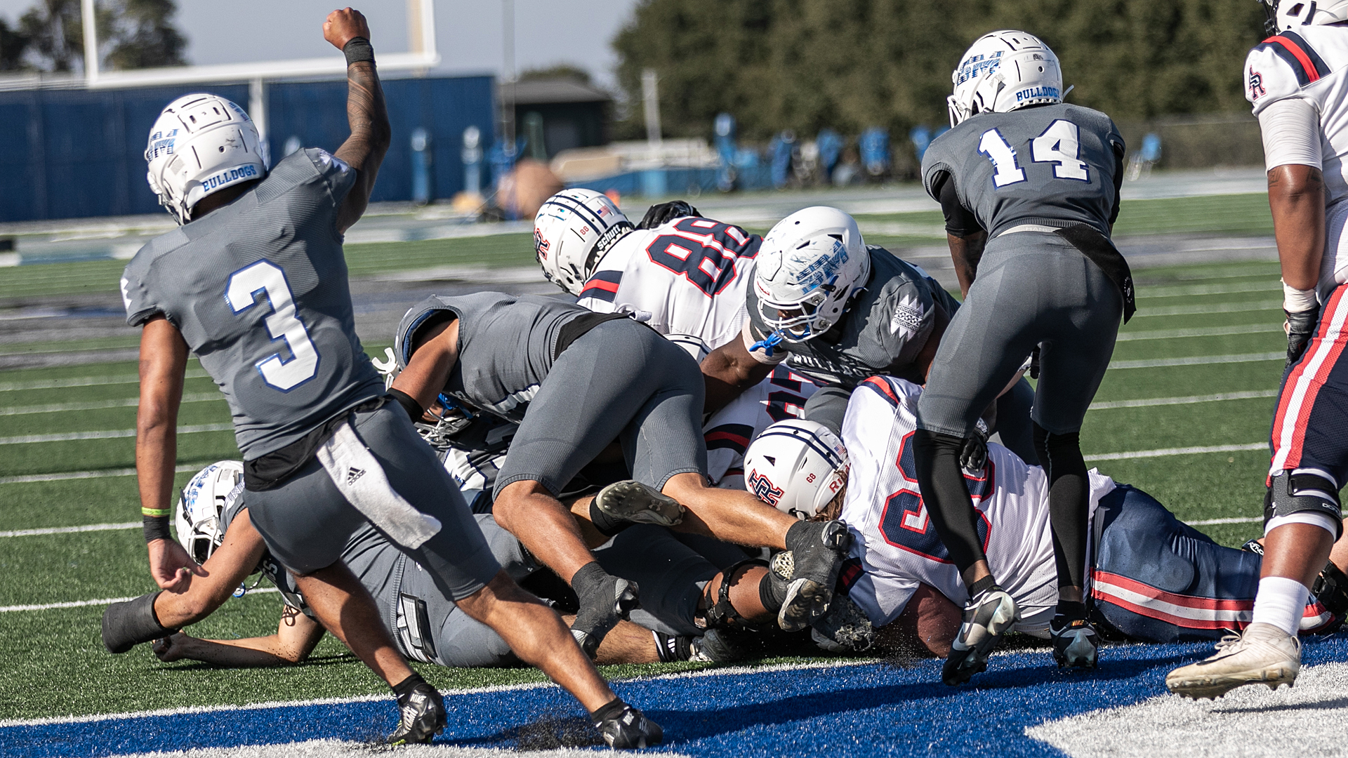 The Bulldogs' defense stops ARC short on its two-point conversion try late in Saturday's win. (Photo by Ronald Rugel)